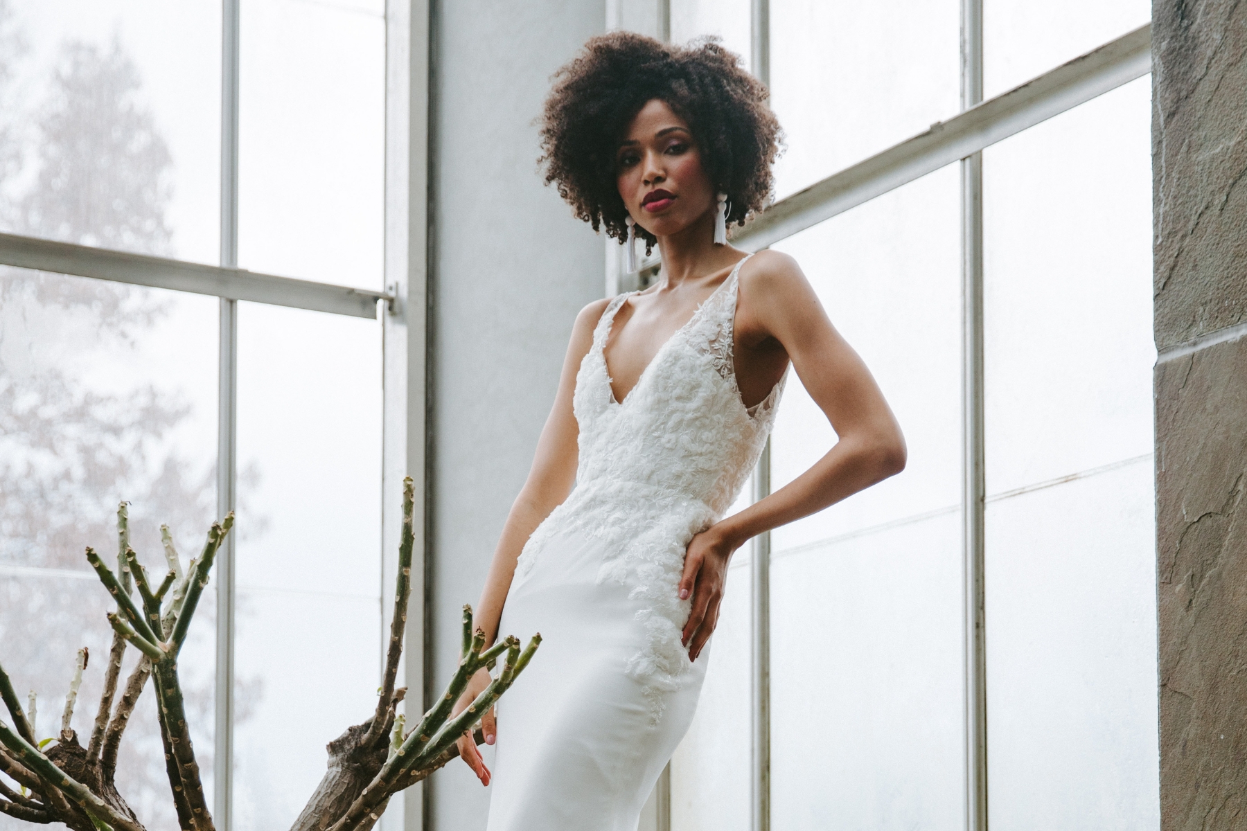 Black bride with afro in a white dress