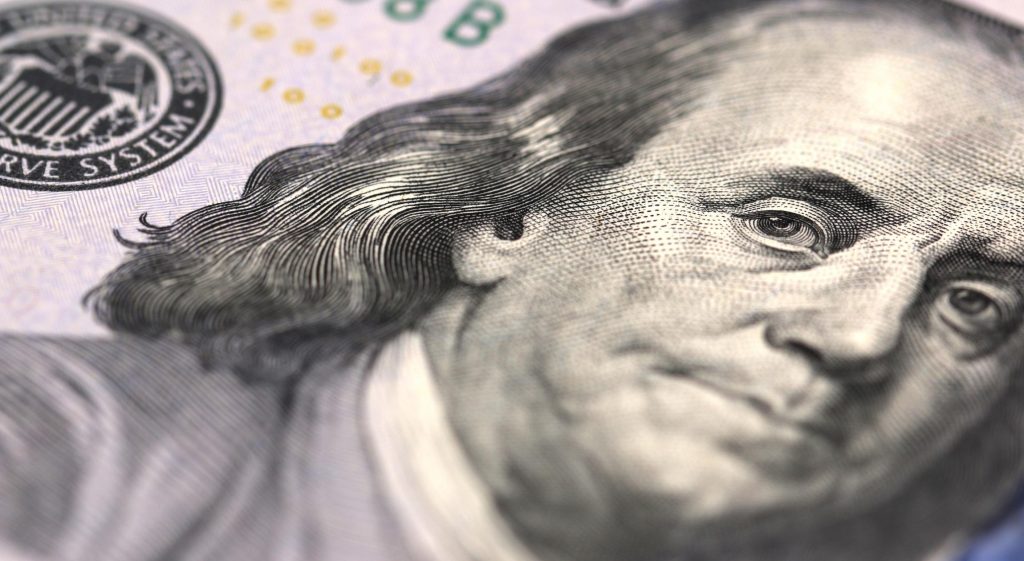 A close up on a $100 dollar bill