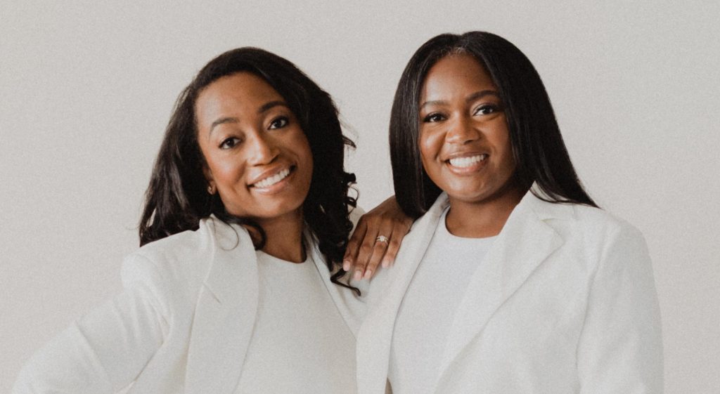 Two Black women in all white