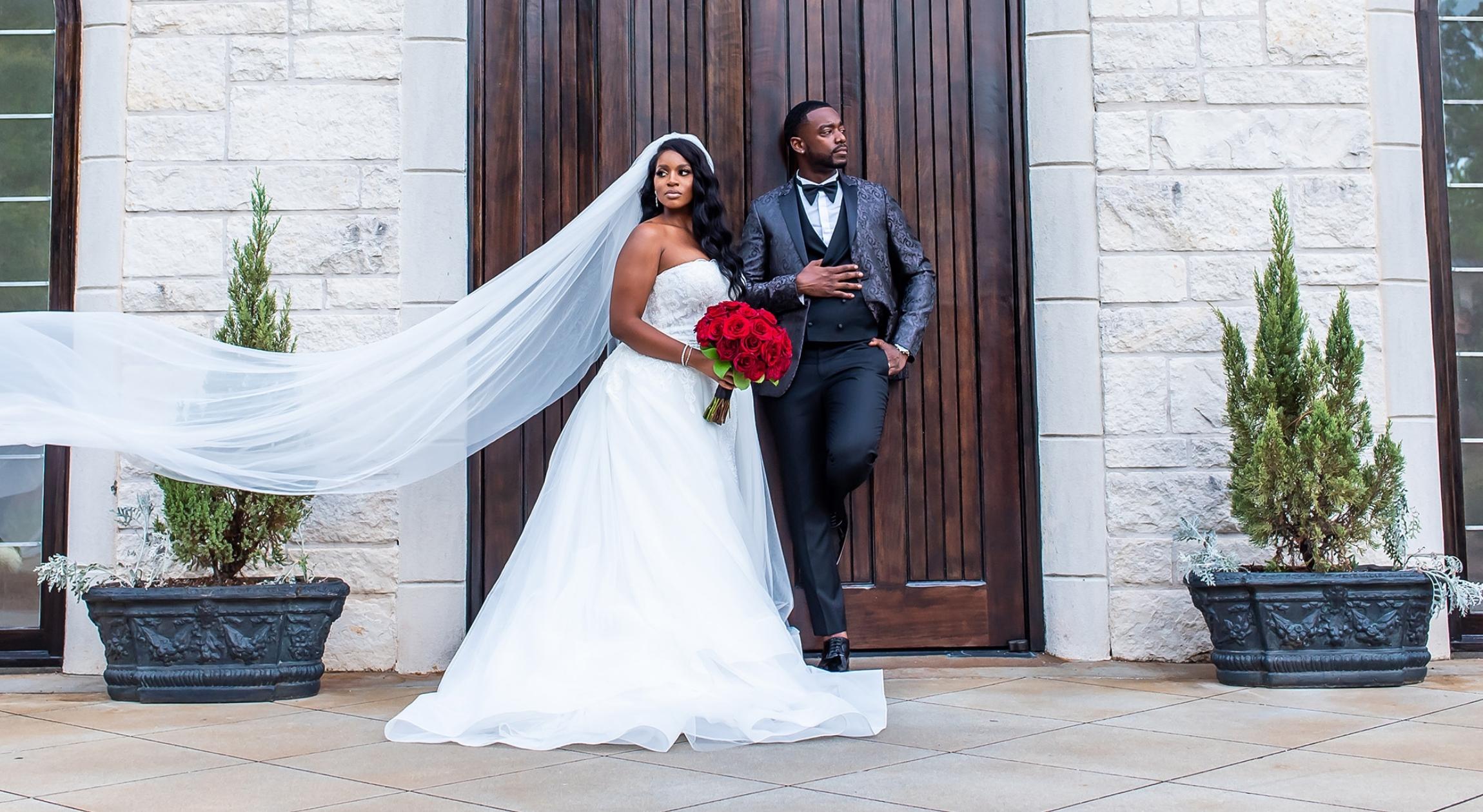 An African American couple outside of a wedding chapel