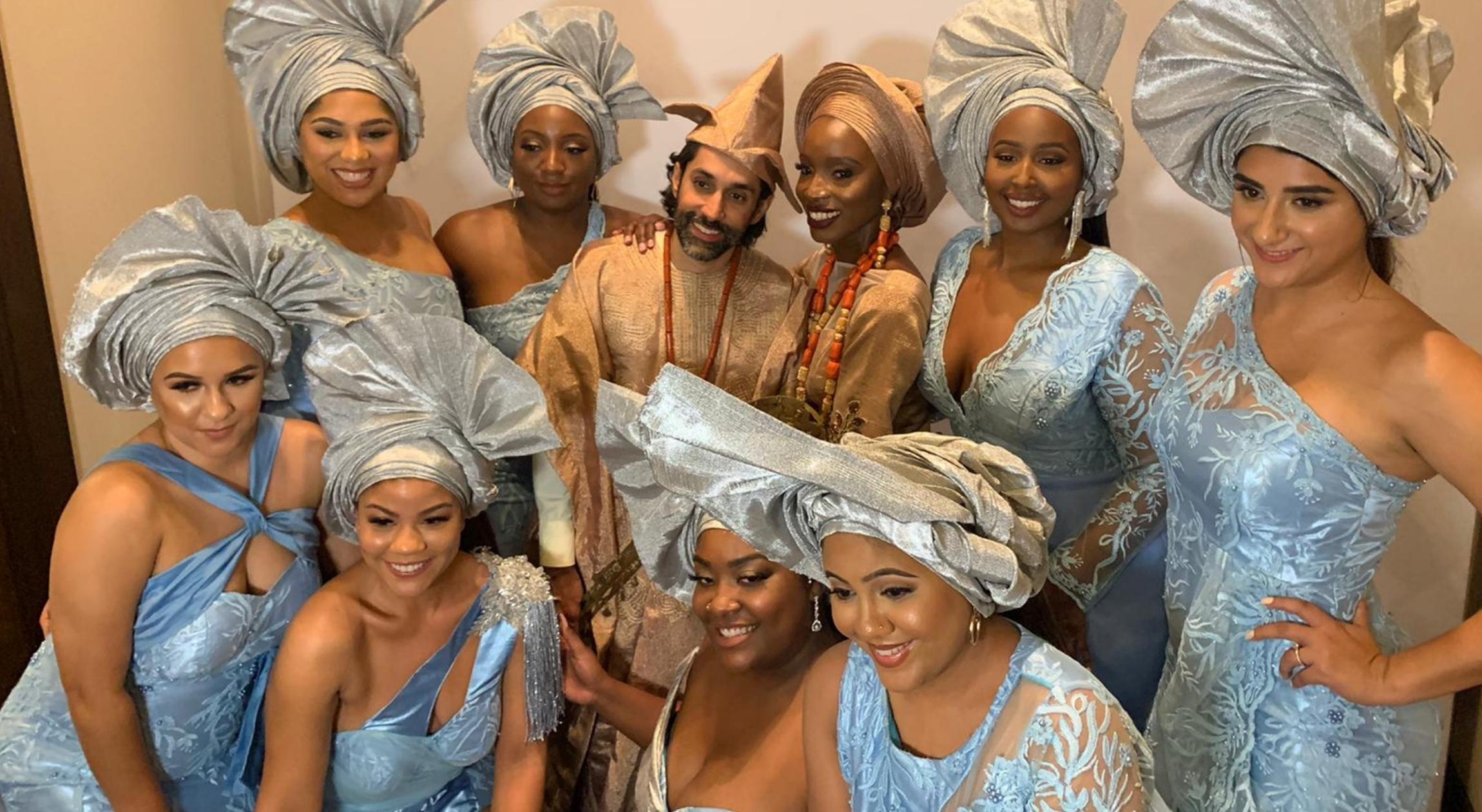 A Hindu husband and Nigerian wife with their bridesmaids in Nigerian attire