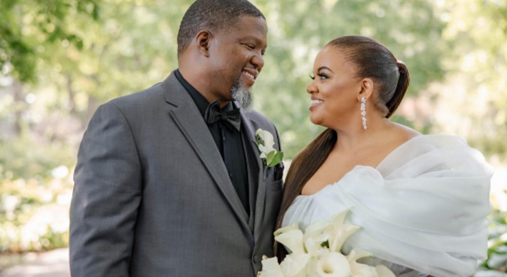 An African American couple smiling at each other