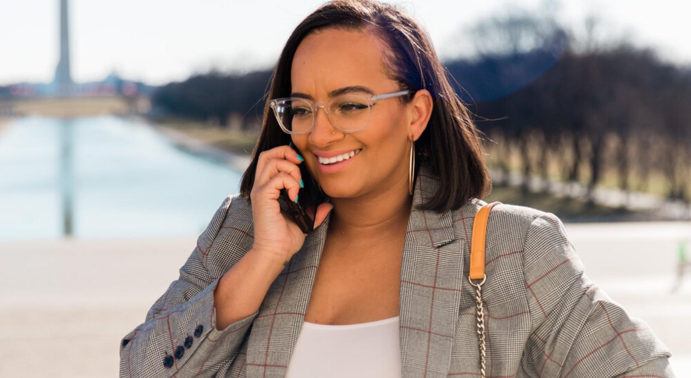 A Black woman on the phone in DC