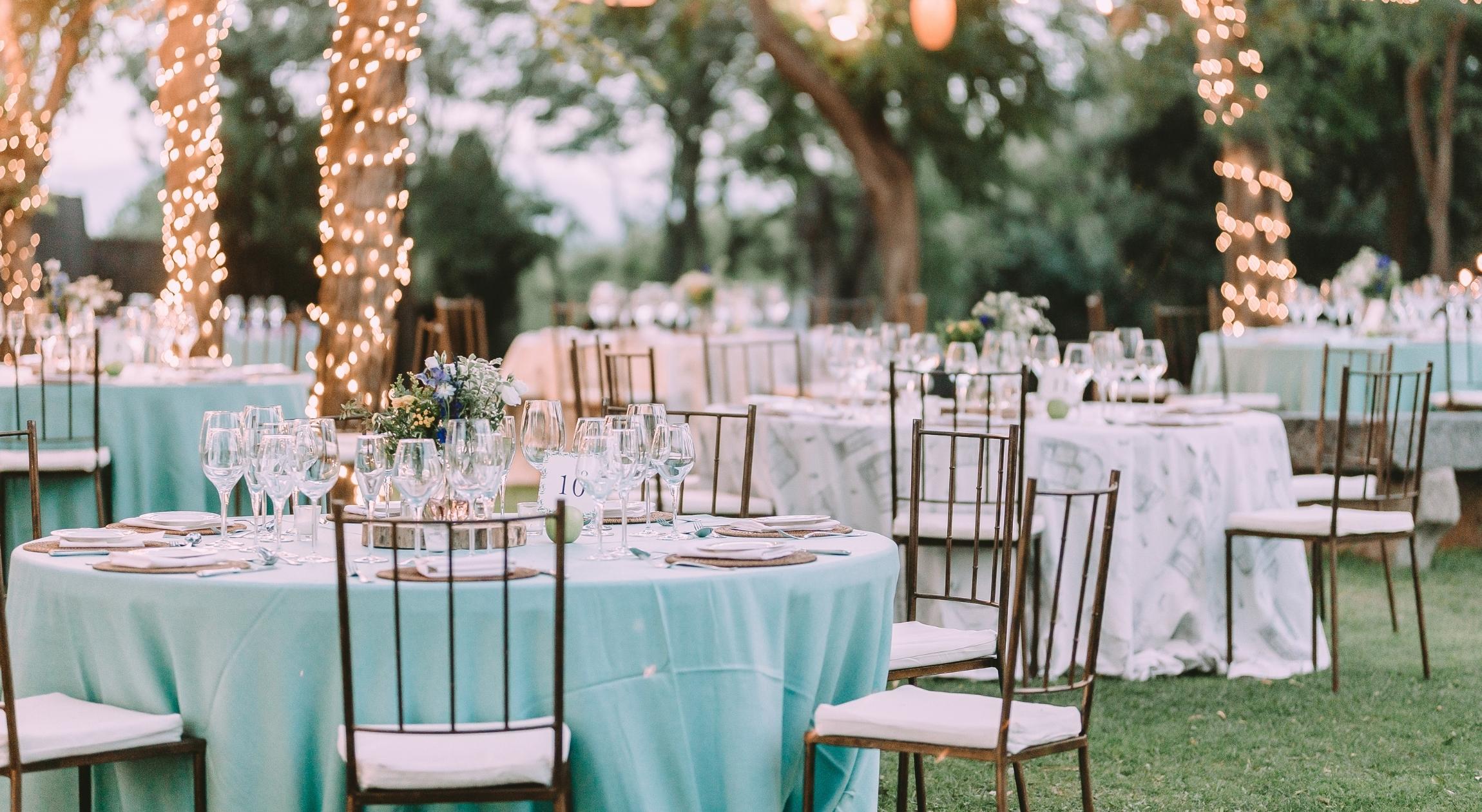 Tables and chairs decorated outdoors