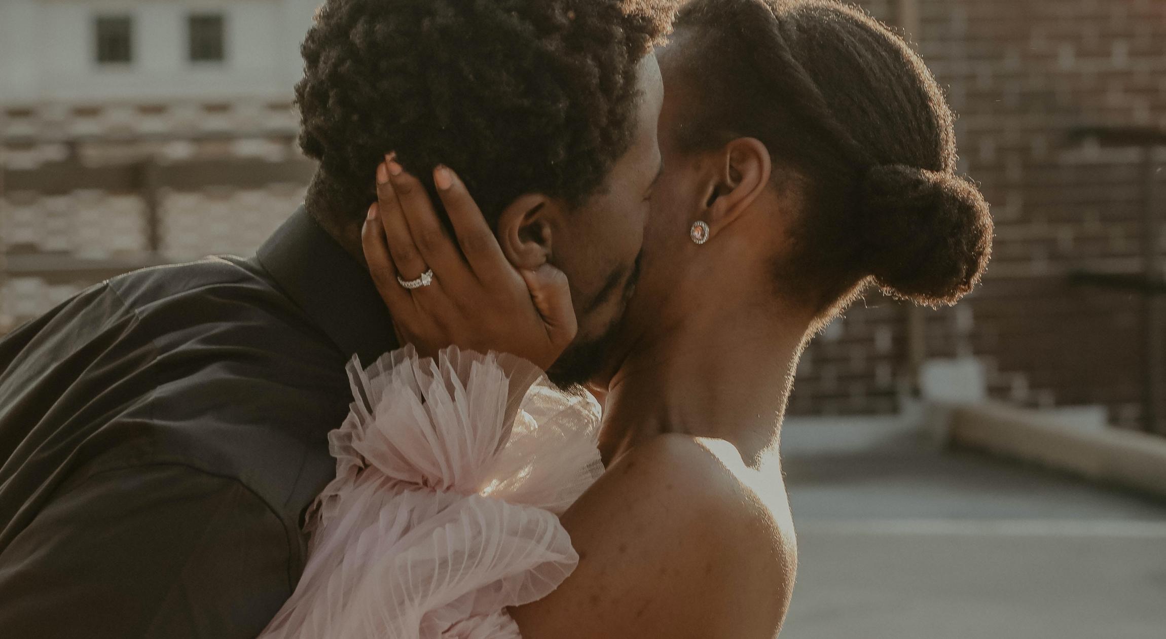 A man kisses a woman on the cheek