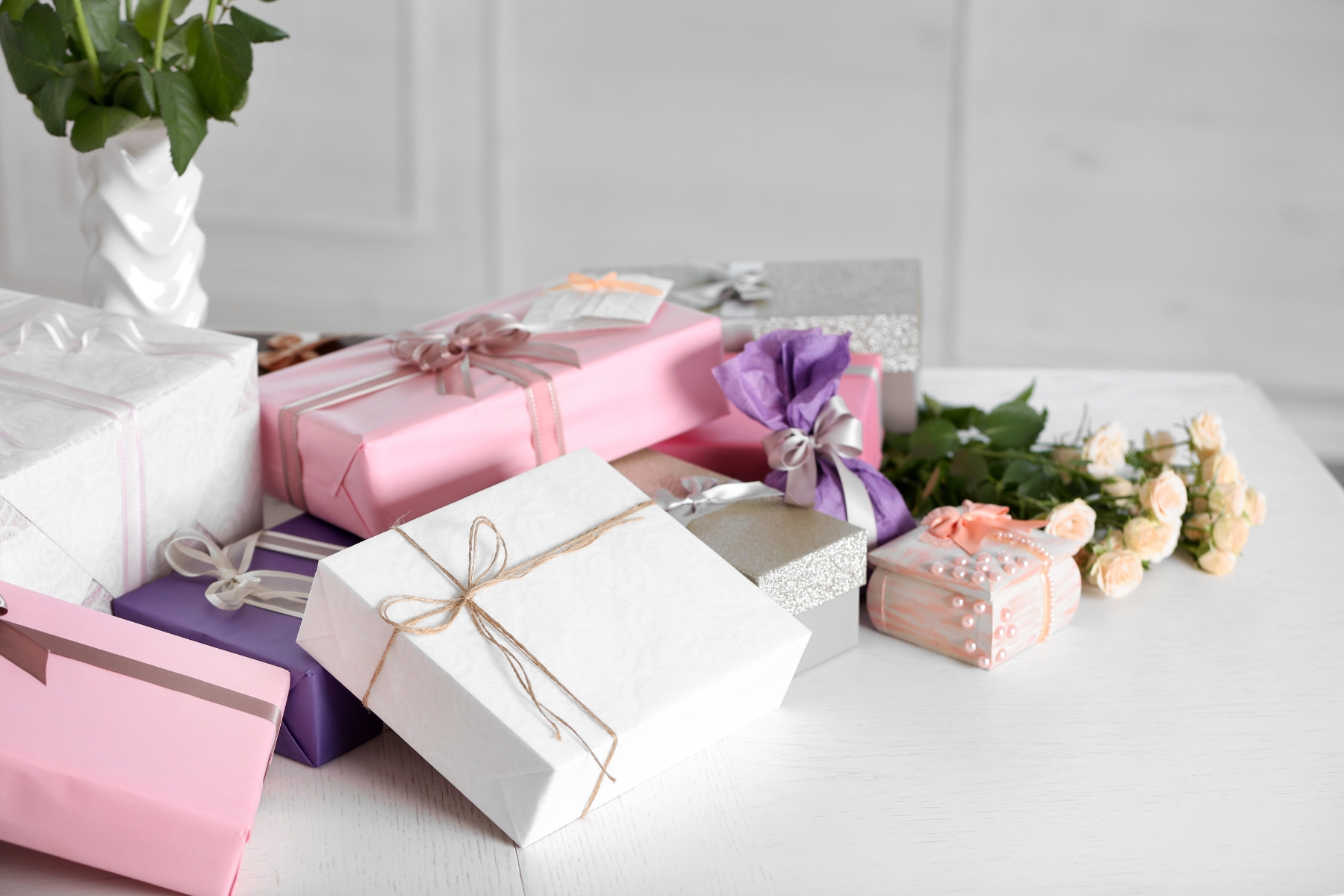 An assortment of boxes wrapped in wrapping paper and bows