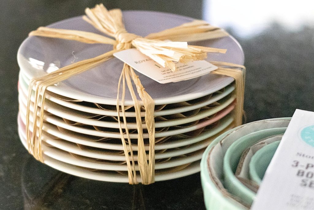 A stack of plates tied together with a bow