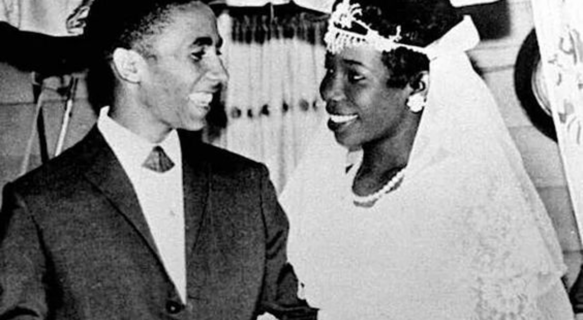 an old black and white photo of a bride and groom