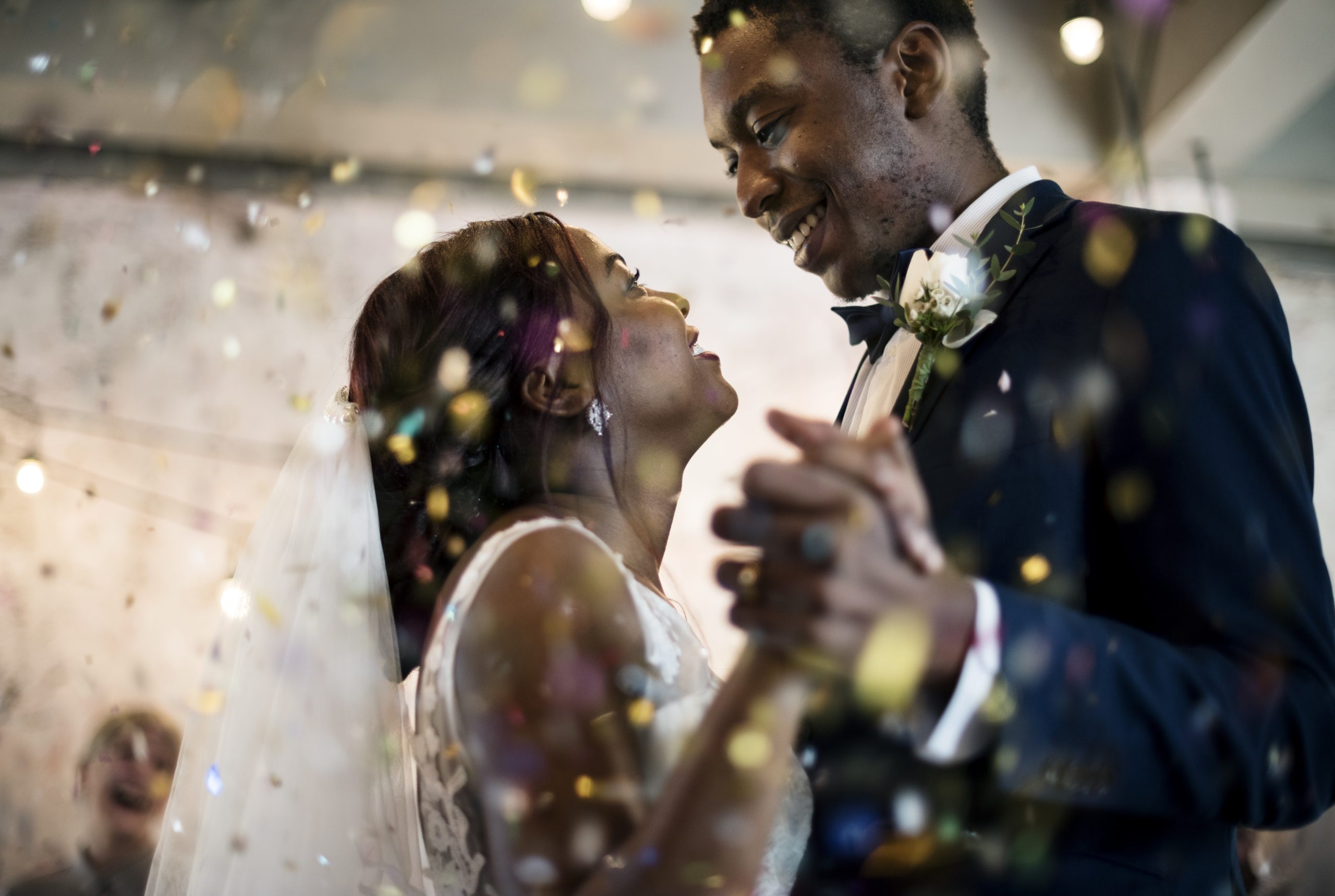 bride and groom share first dance in confetti