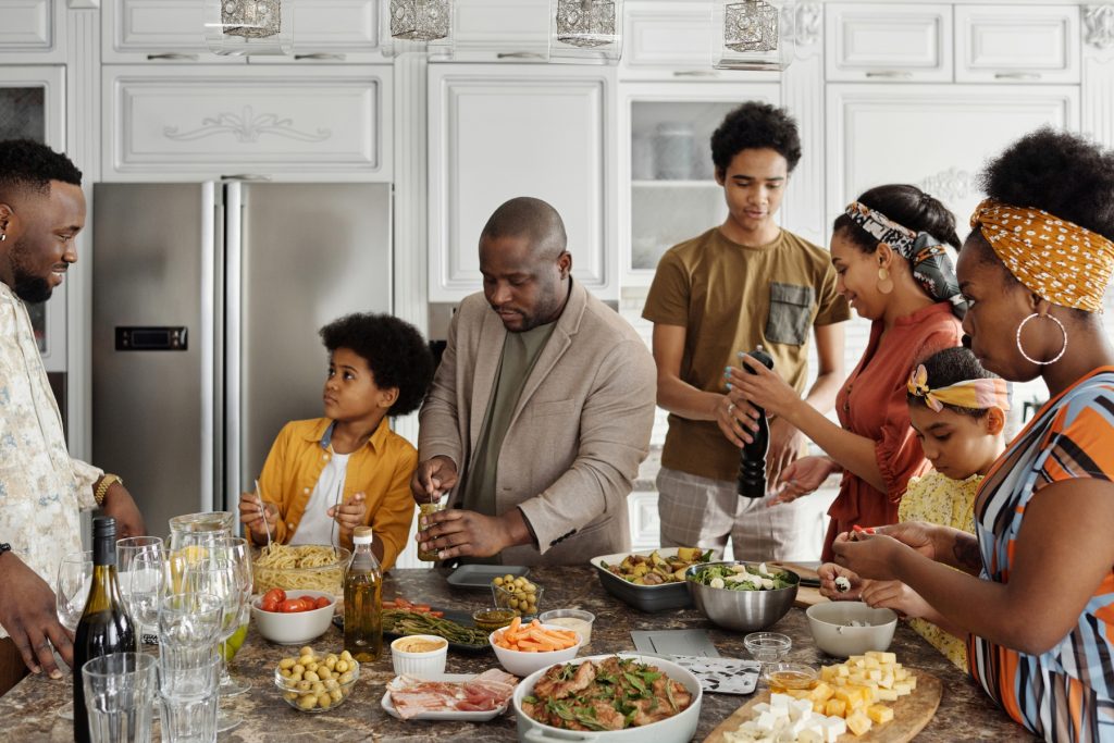 A family in the kitchen preparing food