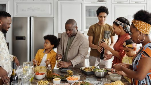 A family in the kitchen preparing food