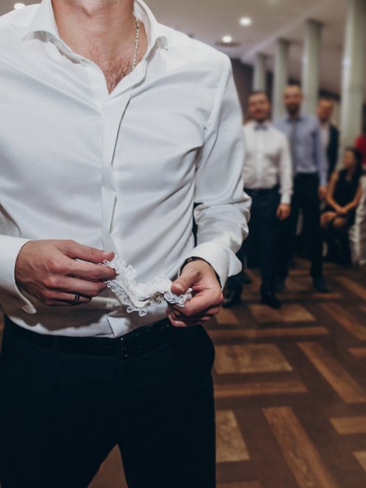 a person in a white shirt standing on a dance floor