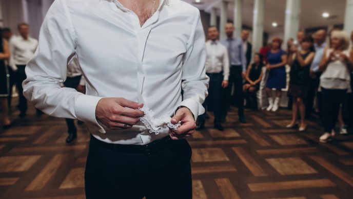 a person in a white shirt standing on a dance floor