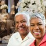 Older Black couple sitting at a wedding reception