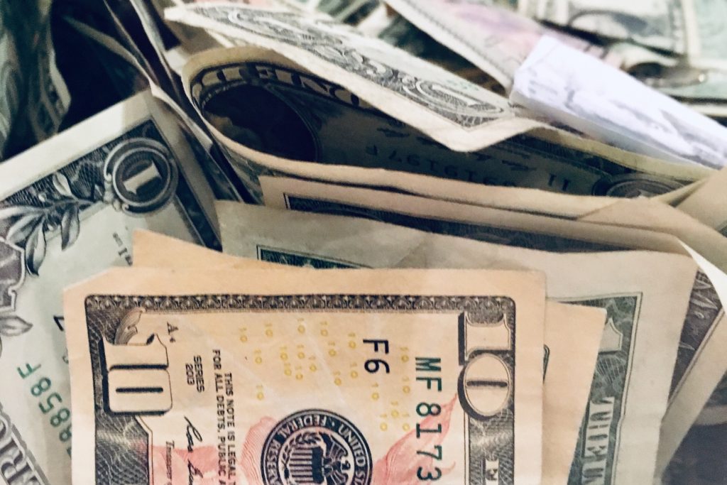 a pile of money sitting on top of each other