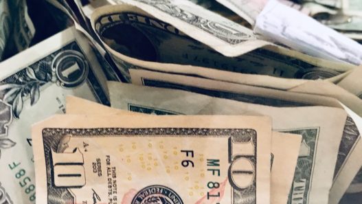 a pile of money sitting on top of each other