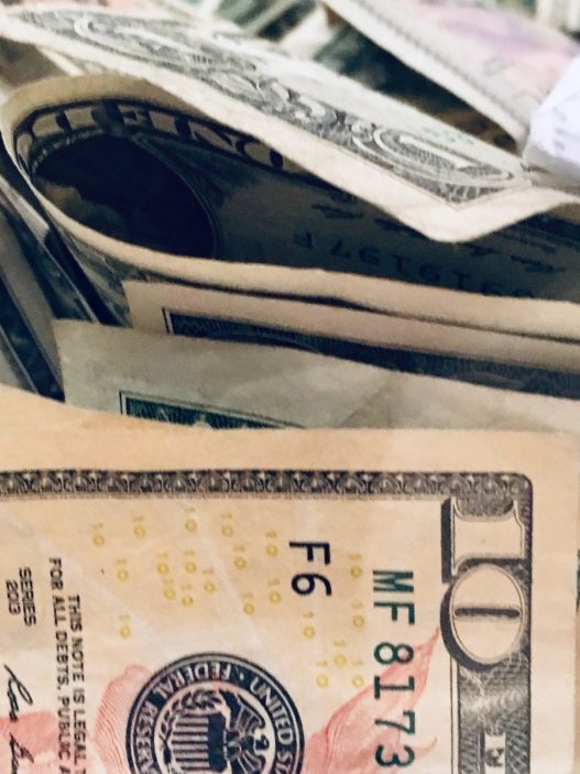 a pile of money sitting on top of each other