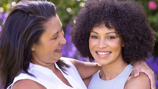 A woman and her mother in the garden.