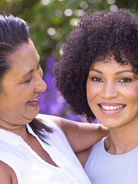 A woman and her mother in the garden.