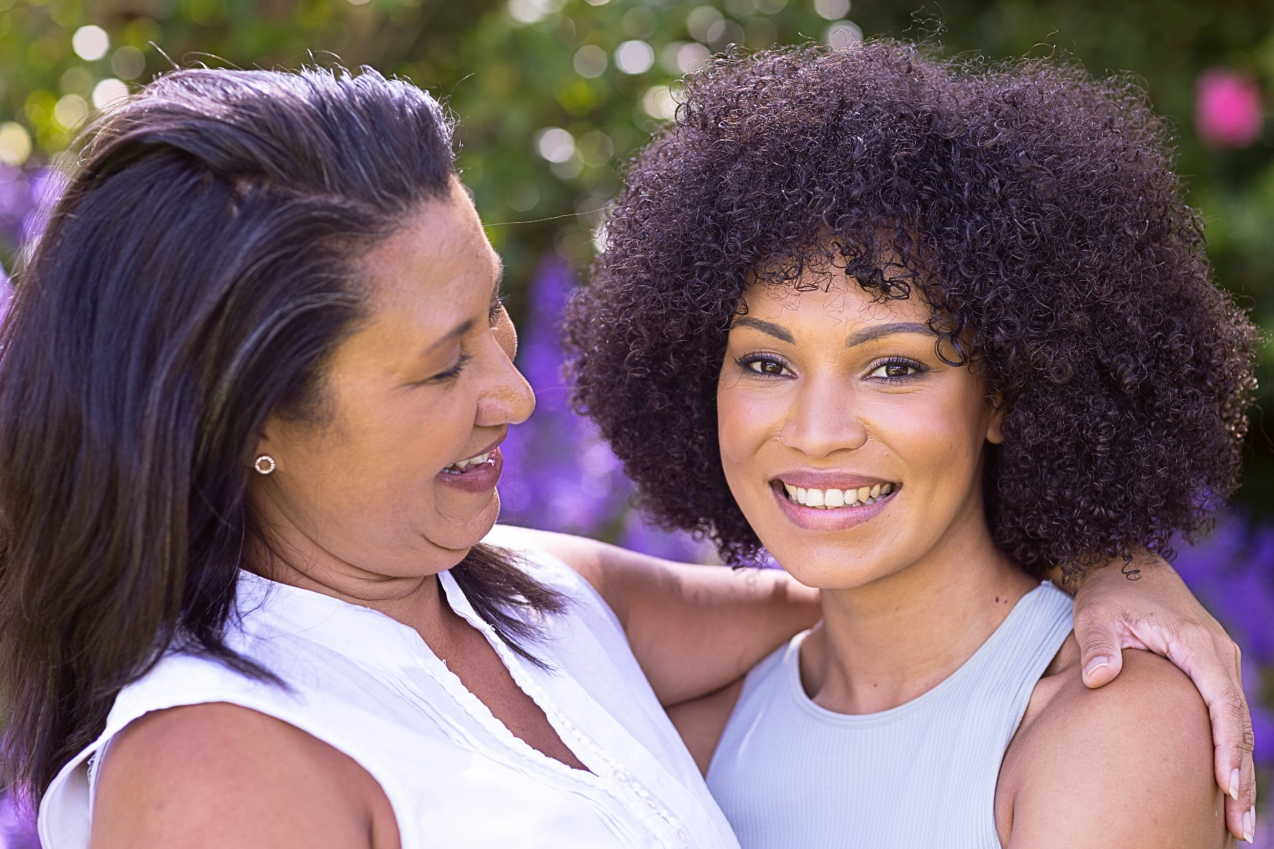 A woman and her mother in the garden.