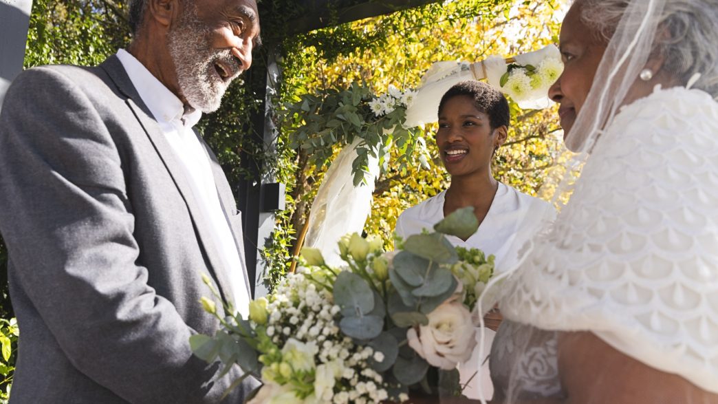 An older Black couple getting married.