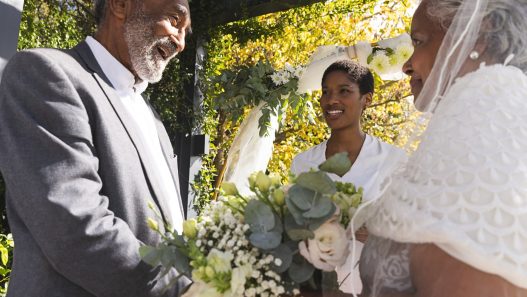 An older Black couple getting married.