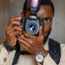 a person taking a picture with their camera