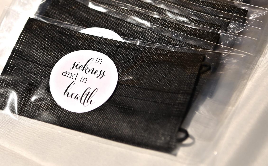 Black medical masks wrapped in plastic