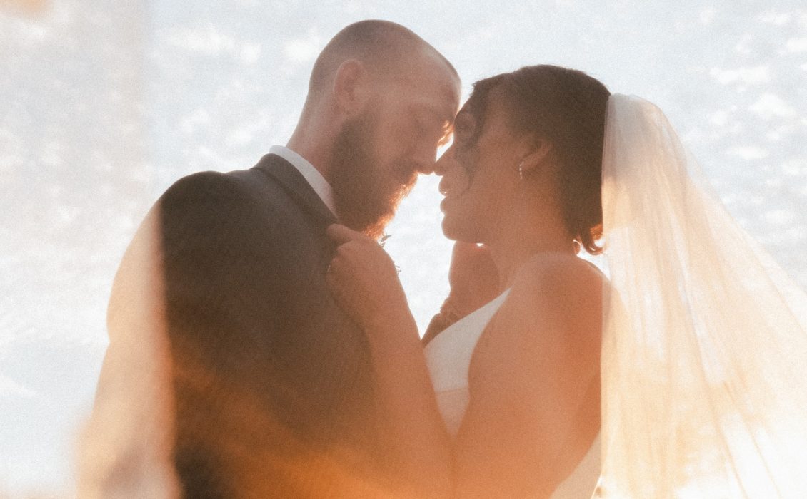 An interracial couple on their wedding day