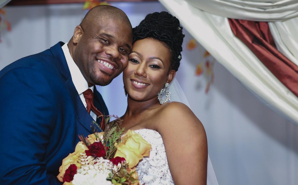 A Black couple in wedding attire