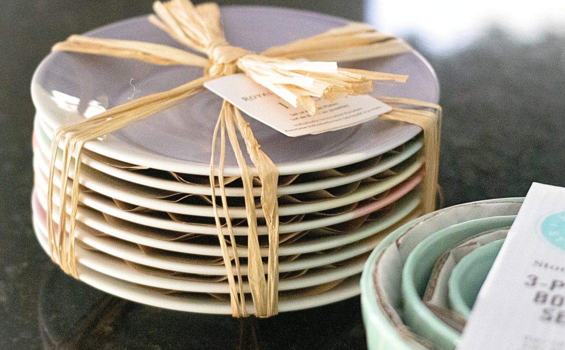A stack of plates tied together with a bow